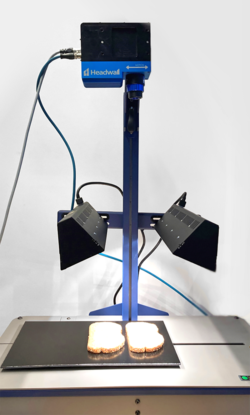 The perClass Mira Stage with Headwall MV.C NIR hyperspectral imager, scanning moisture content in bread